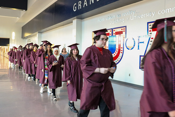 Graduates file into the ceremony